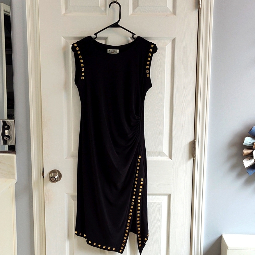 Black dress with metal embellishments, slit on one side.SOHO Apparel size M.